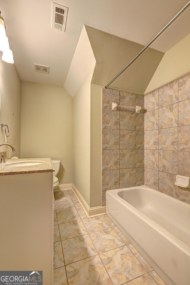 bathroom with visible vents, vaulted ceiling, and toilet