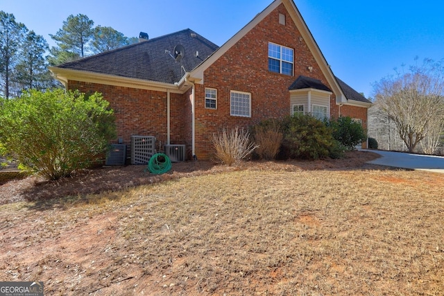 view of side of home featuring brick siding