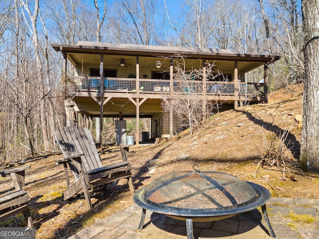 back of property with a patio area, ceiling fan, and central air condition unit