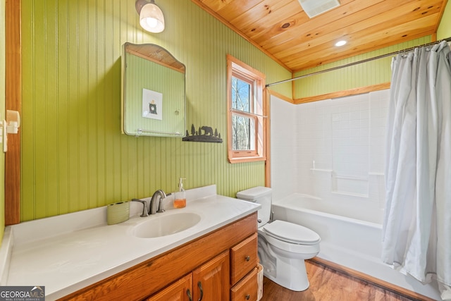 full bathroom with toilet, shower / tub combo with curtain, wood finished floors, wooden ceiling, and vanity