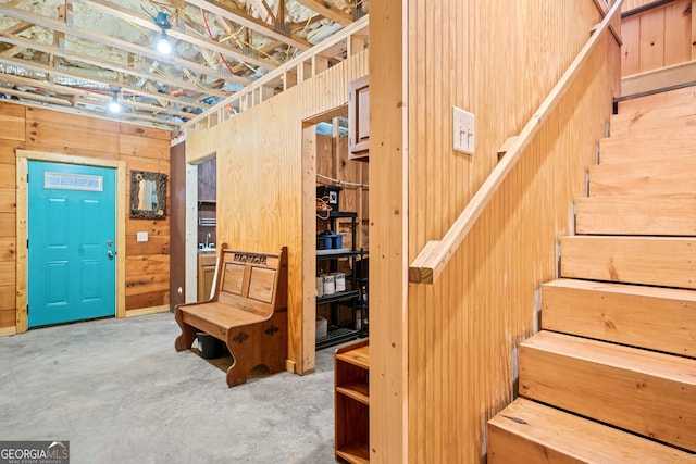 basement featuring stairs