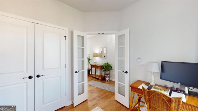 office area featuring french doors and light hardwood / wood-style flooring