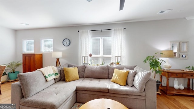 living room with light hardwood / wood-style flooring