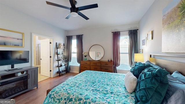 bedroom featuring ceiling fan and light hardwood / wood-style flooring