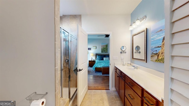 bathroom featuring vanity, tile patterned flooring, an enclosed shower, and ceiling fan