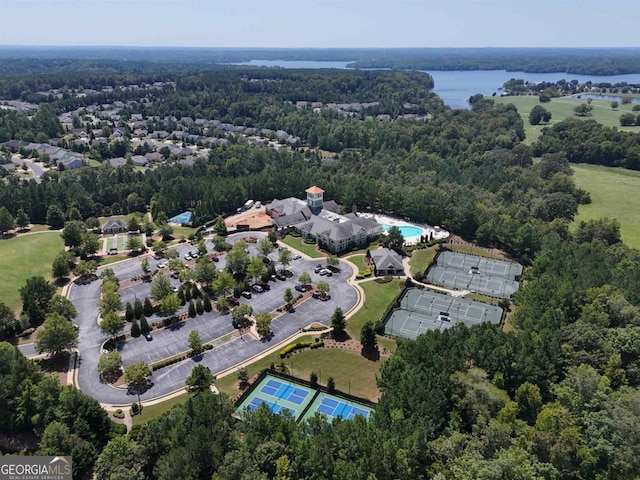 birds eye view of property with a water view