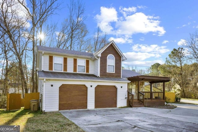 view of front of home with a garage and a porch