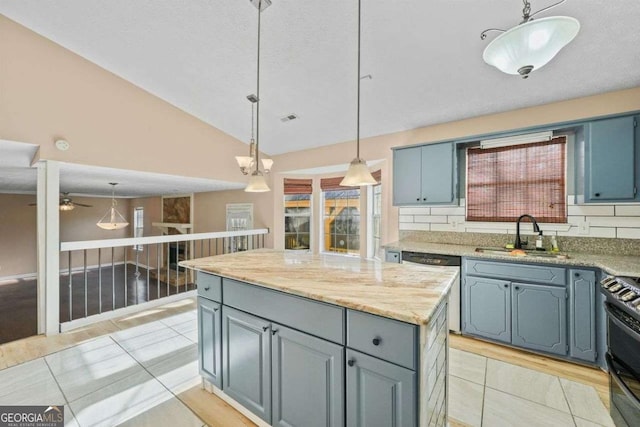 kitchen featuring stove, dishwasher, pendant lighting, a center island, and sink