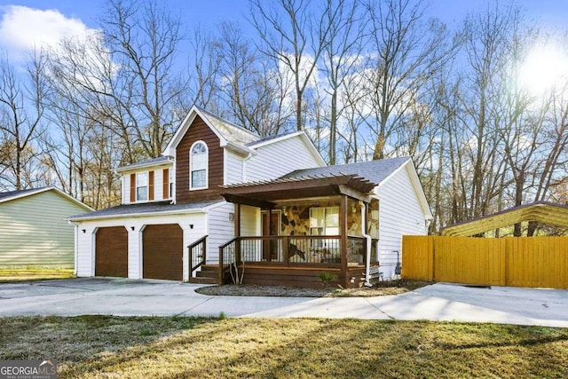 view of front of house featuring a garage and a porch