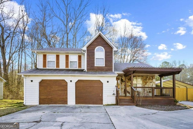 view of front facade with a garage and a porch