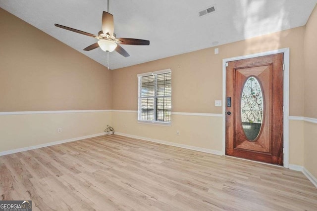 entryway with light wood-type flooring, vaulted ceiling, and ceiling fan