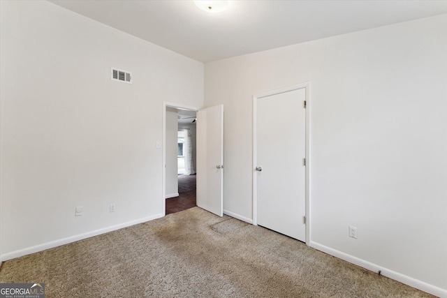 unfurnished bedroom with carpet flooring