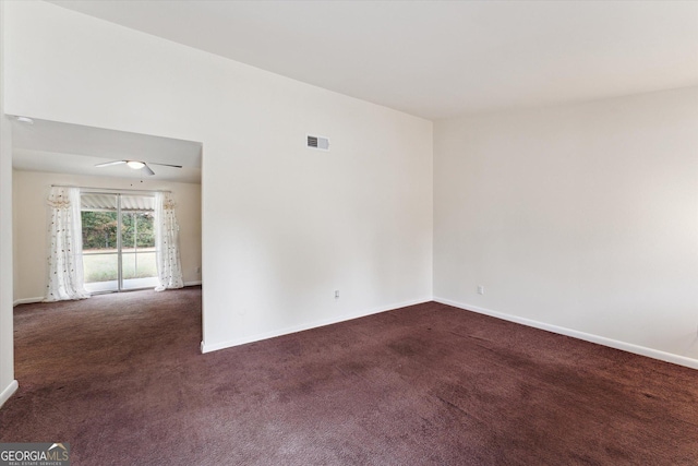 carpeted empty room featuring ceiling fan