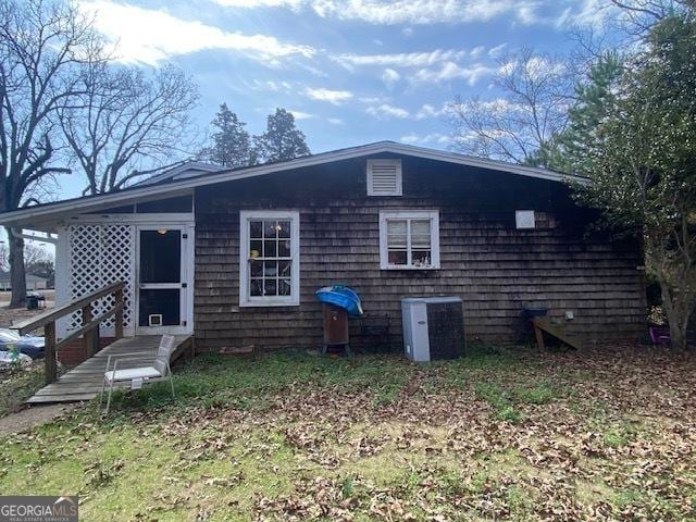 back of property with central air condition unit