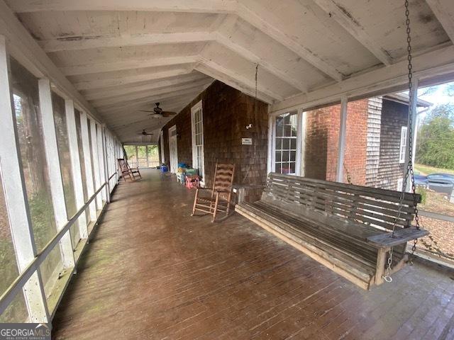 exterior space featuring vaulted ceiling