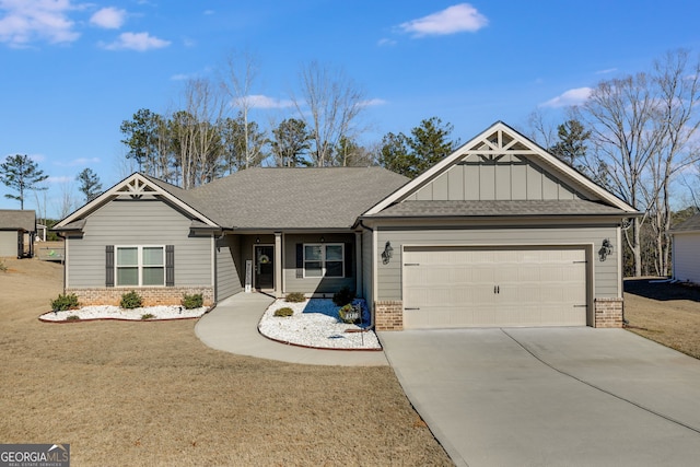 view of front of property with a garage and a front lawn