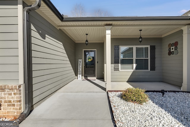 property entrance with covered porch