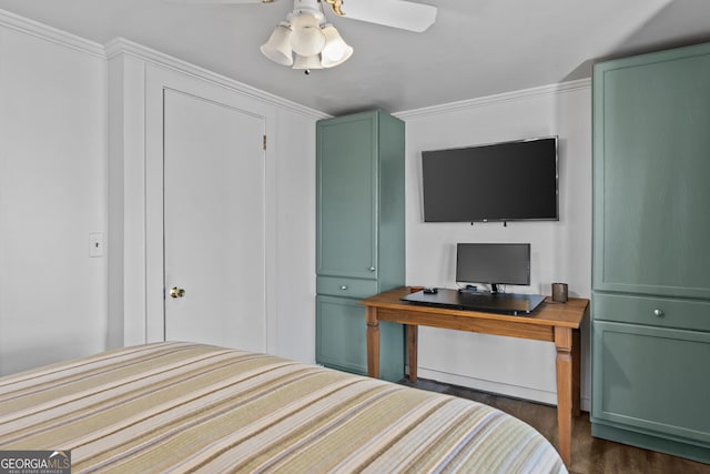 bedroom with dark hardwood / wood-style flooring and ceiling fan