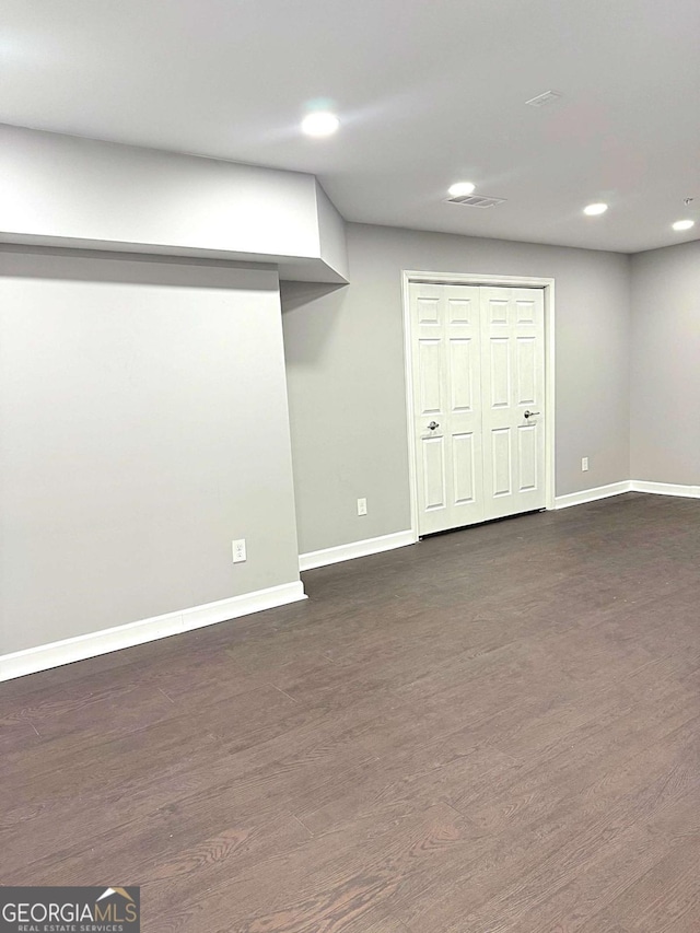 basement featuring dark wood-type flooring