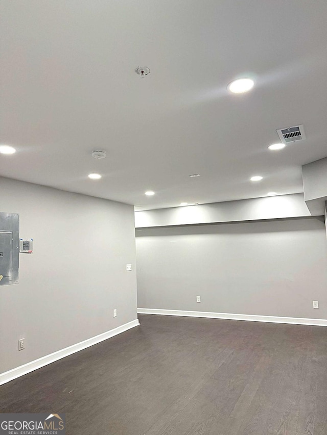 basement featuring dark wood-type flooring