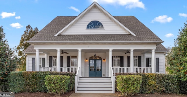 neoclassical / greek revival house with covered porch, french doors, and ceiling fan