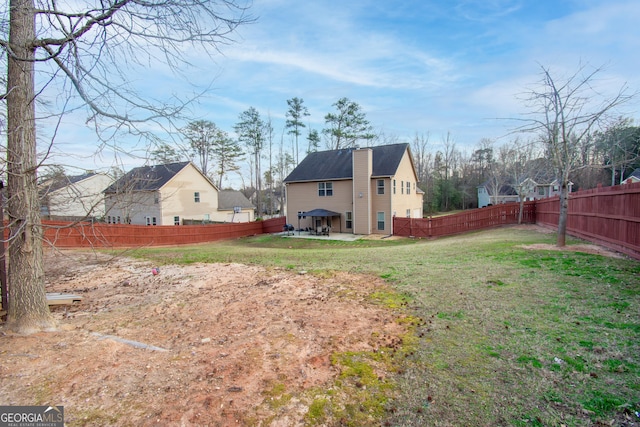 view of yard featuring a fenced backyard and a patio