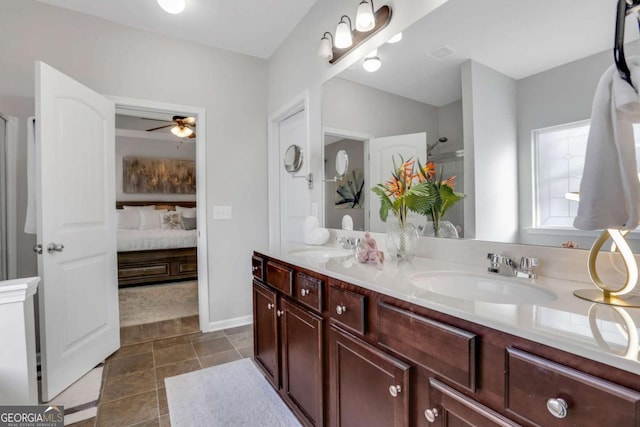 bathroom with vanity, walk in shower, and ceiling fan