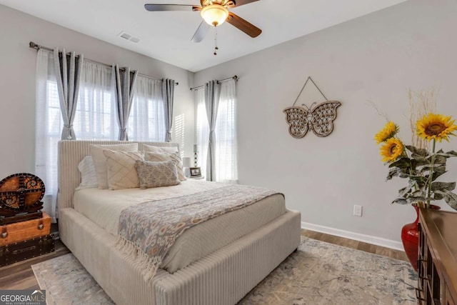 bedroom featuring hardwood / wood-style floors and ceiling fan