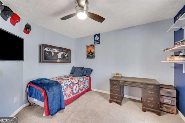 bedroom featuring carpet flooring, baseboards, and ceiling fan