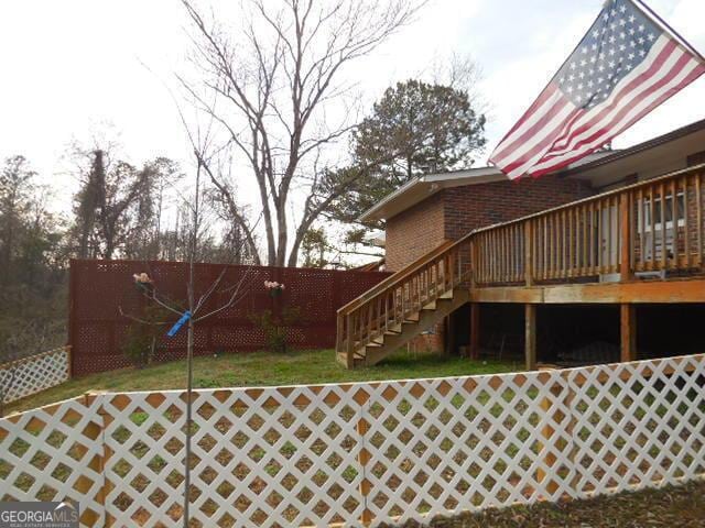 view of yard featuring a wooden deck