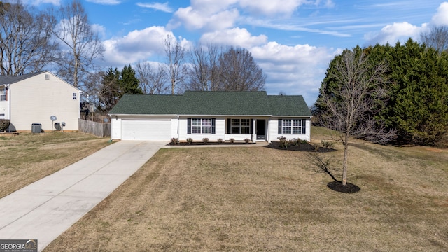 ranch-style home with a garage, fence, driveway, roof with shingles, and a front lawn