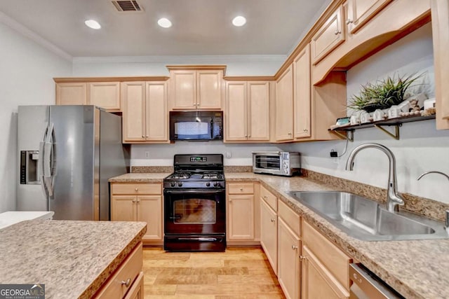 kitchen featuring light brown cabinetry, black appliances, light hardwood / wood-style floors, ornamental molding, and sink