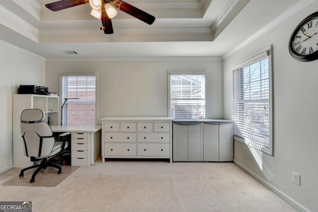 carpeted home office featuring a raised ceiling, ceiling fan, and crown molding