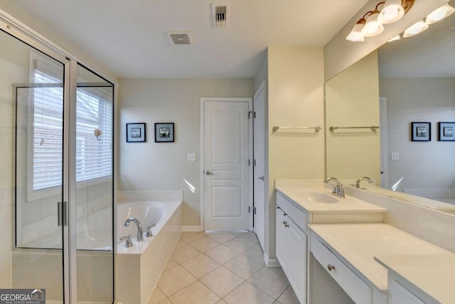 bathroom featuring tile patterned floors, separate shower and tub, and vanity