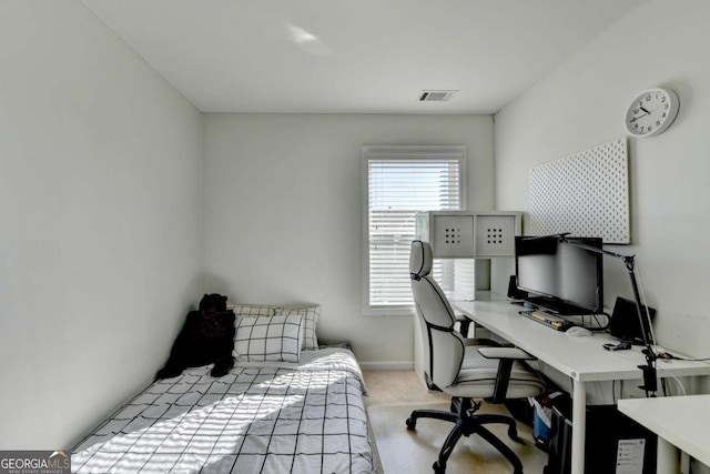 bedroom featuring light carpet