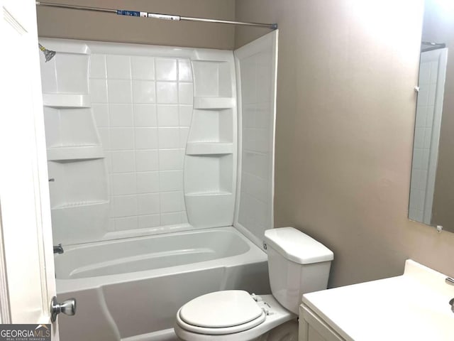 bathroom with toilet and bathing tub / shower combination