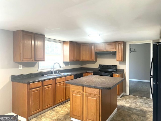 kitchen featuring sink, a kitchen island, and black appliances