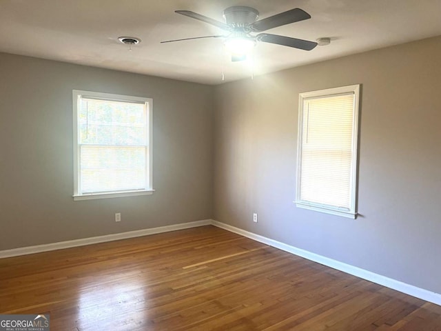 unfurnished room featuring ceiling fan and wood-type flooring