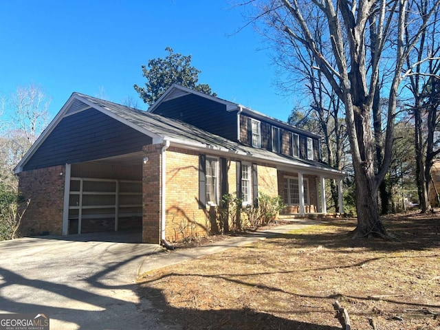 view of side of property featuring a carport and a garage