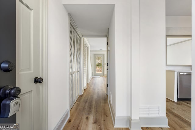 hallway featuring light hardwood / wood-style flooring