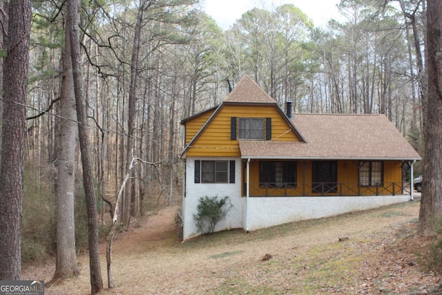 view of home's exterior featuring covered porch