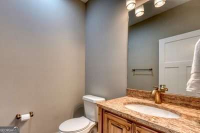 bathroom featuring toilet and vanity