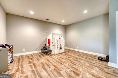 recreation room with light hardwood / wood-style floors