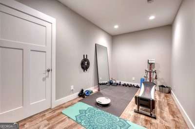 workout room with hardwood / wood-style floors