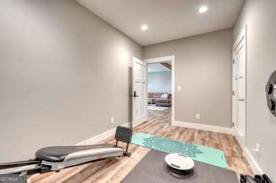 exercise area featuring wood-type flooring