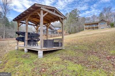 view of yard featuring a gazebo and a wooden deck