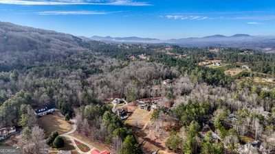 birds eye view of property featuring a mountain view