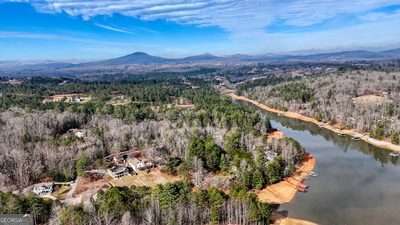 drone / aerial view with a water and mountain view