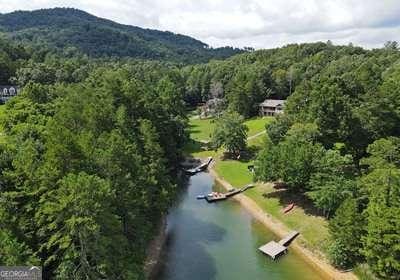 drone / aerial view with a water and mountain view