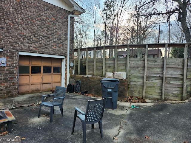 view of patio featuring a garage